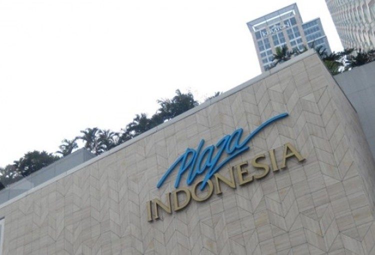 The Plaza Indonesia sign on the mall's stone façade in Jakarta